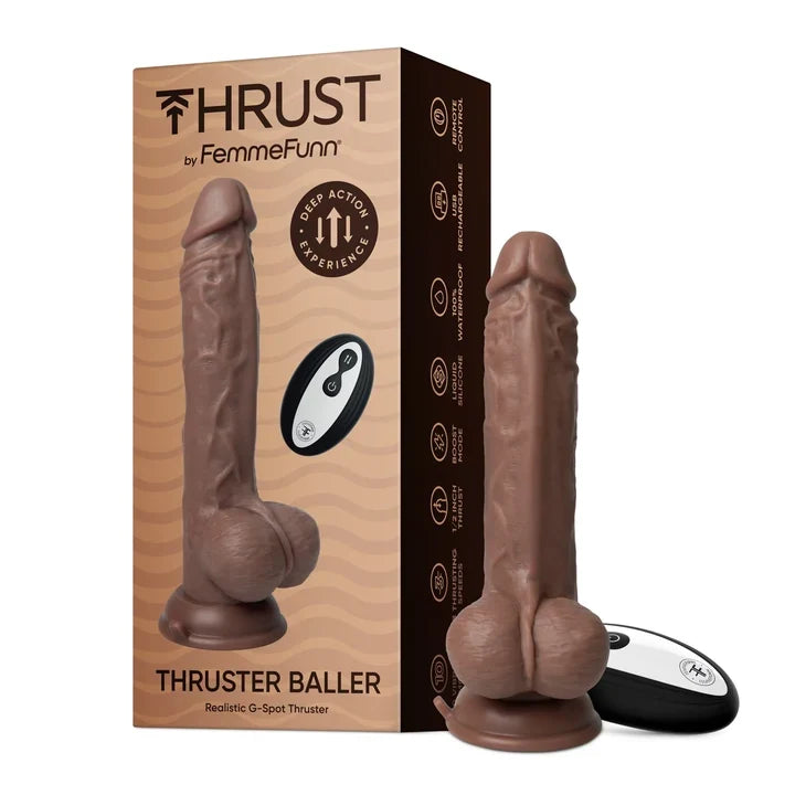 Un gode vibrant Thrust de FemmeFunn, présenté à côté de sa boîte marron sur fond blanc.