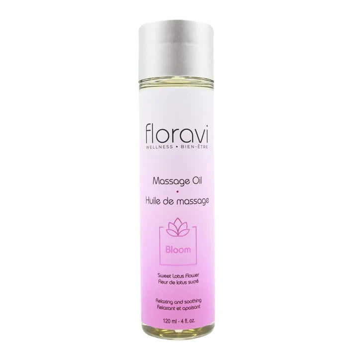 Un flacon d'huile de massage Floravi rose sur fond blanc.